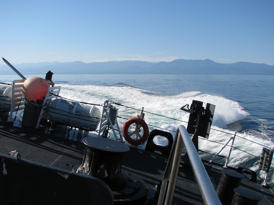 View of rear of frigate's helicopter deck, canted to port.