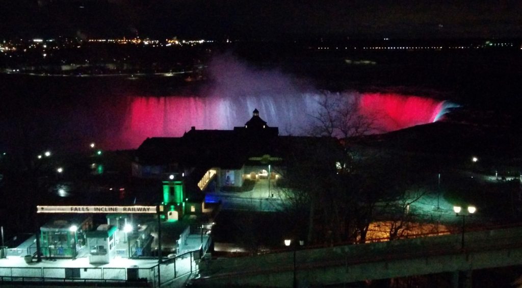 Horsehshoe Falls illuminated with coloured lights.