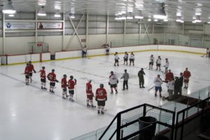 Two pick-up teams line up for the start of a hockey game