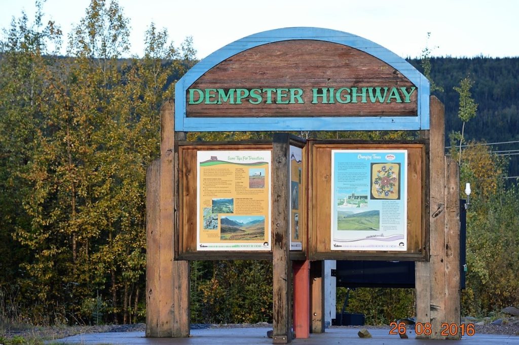 Sign marking southern start of Dempster Highway.