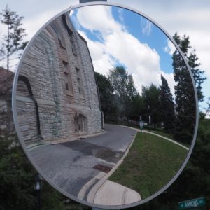 Reflection in corner-mounted circular mirror on RMC campus.