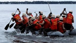 Recruits paddling dinghy.