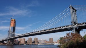 Shore-level view of Manhattan Bridge towers and span to Manhattan