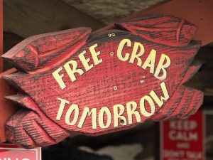 Sign advertising "free crab tomorrow" at Crab Catcher's Restaurant