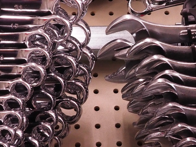 Wrenches displayed in hardware store, appearing to attack each other