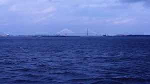 Long-distance view of Arthur J. Ravenel Bridge and Yorktown aircraft carrier