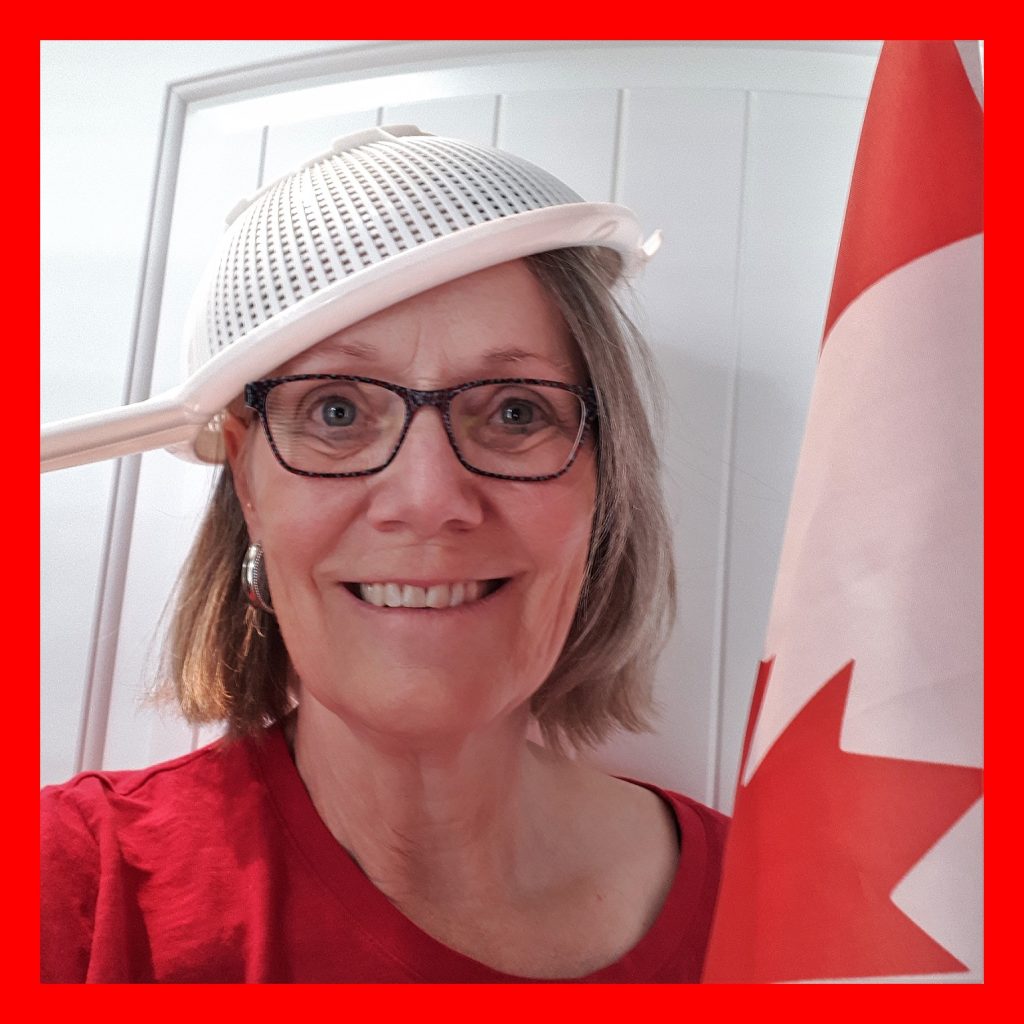 Canada Day celebrator with flag and sieve.